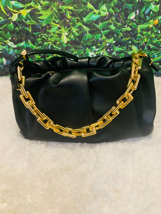 Black purse with gold link strap